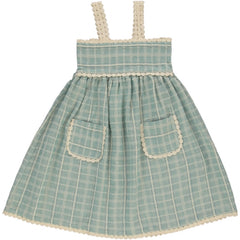 The Mia Dress by Bebe Organic, light blue check cotton kids dress with lace trim straps, gathered waist, and front pockets.