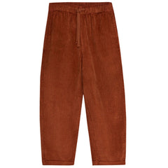 The Nicol Pant Infinite Navy from The New Society. Brown corduroy pants featuring a straight fit and an adjustable waistband.