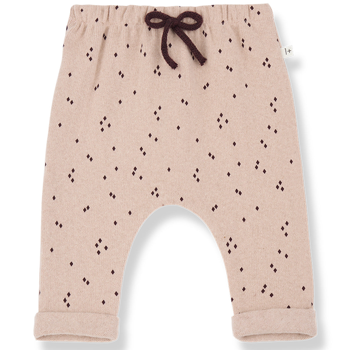 The Nora Pants from 1+ in the Family. Knit baby pants with an elastic waistband, and all-over geometric dot pattern.