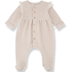 Orleans Jumpsuit with Feet by 1+ in the Family with beige stripes, shoulder ruffles and footed legs.