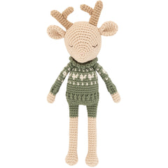 The Robin Reindeer Doll from Patti Oslo. Knitted deer toy with a green sweater on a white background.
