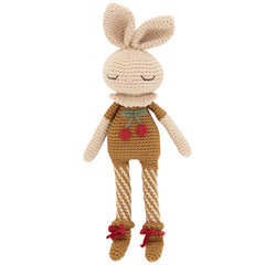 The Britney Bunny Cherry Blossom Doll from Patti Oslo, handcrafted crochet bunny in brown with cherry details and long legs.