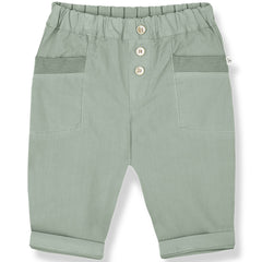 The Portbou Pants from 1+ in the Family in iceberg green with elastic waist, front buttons, patch pockets, and rolled cuffs.