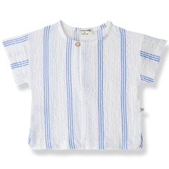 The Portlligat Shirt from 1+ in the Family with ultramarine vertical stripes, short sleeves, and a front button.