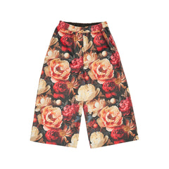 The multi-colored floral pull-on pants by Christina Rohde feature a comfortable wide-leg fit and an elasticated waistband.