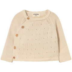 Cozmo Rain Top in cream knit with openwork pattern, long sleeves and asymmetrical wooden button closure.
