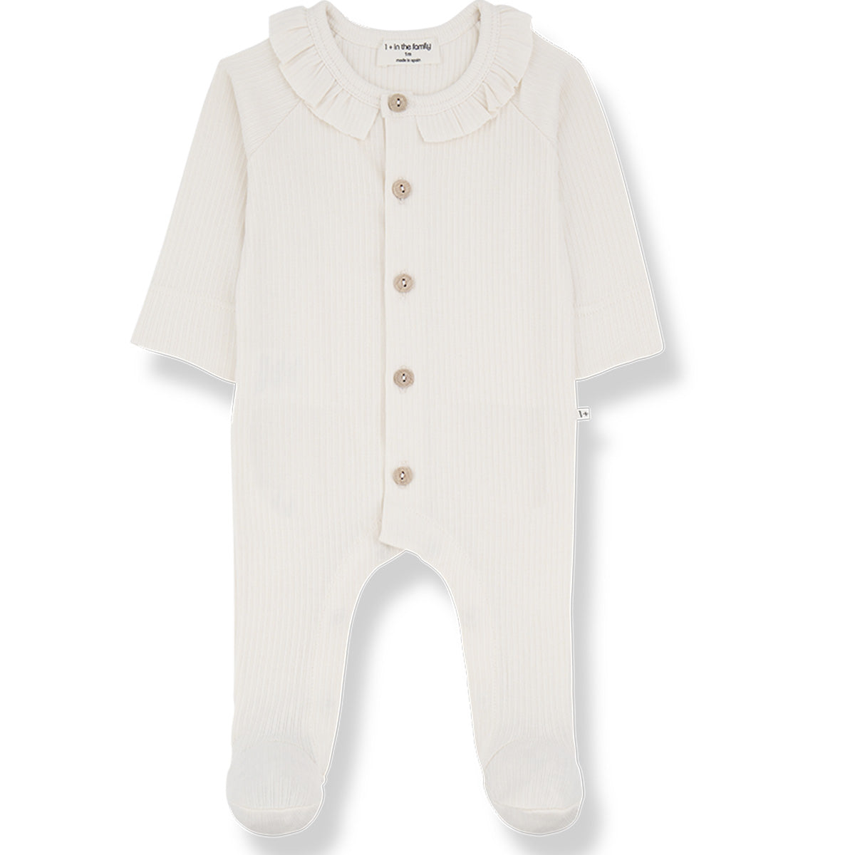 The Rosetta Jumpsuit from 1+ in the Family. A soft, long-sleeved baby onesie in ecru with a delicate ruffled collar.