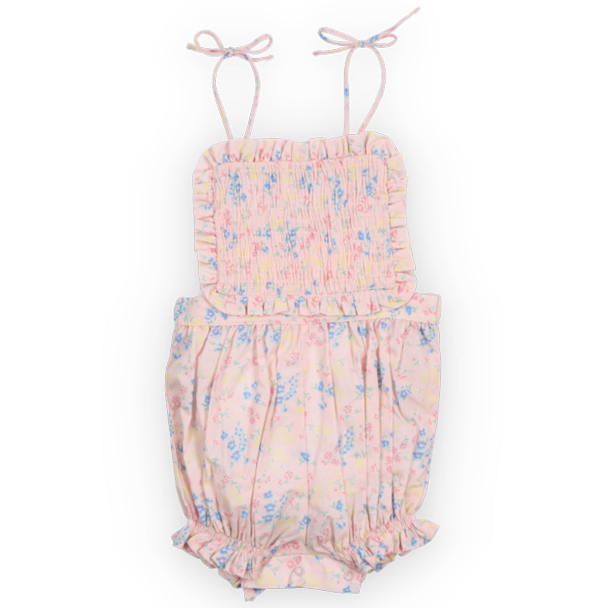 Sabina Baby Romper from The New Society with shoulder ties, smocked bodice, and pastel floral print