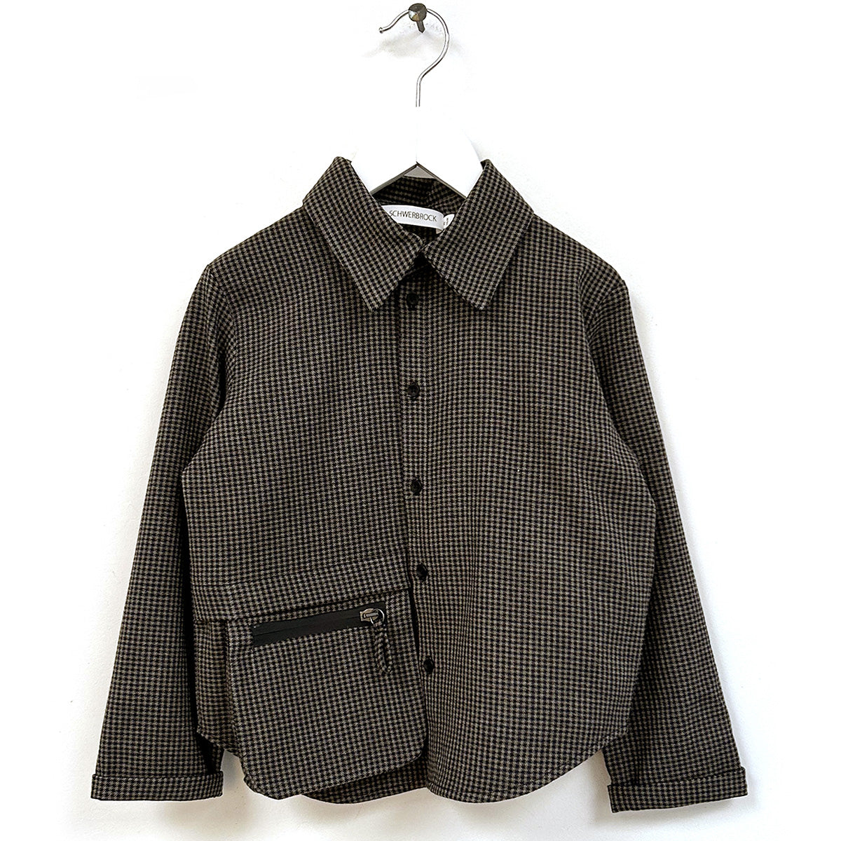 The Samio Oversized Shirt from Anja Schwerbrock. Black and white Houndstooth shirt with a flap pocket.