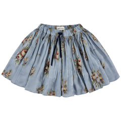 The Sprinter Skirt from Morley in dusty blue watercolor floral with a gathered flare and velvet tie.