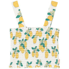 The Oranges Top by Tiny Cottons, off-white sleeveless top with all-over orange print and round neckline.