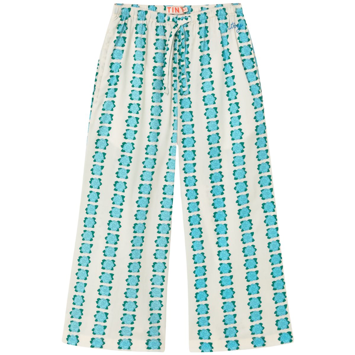 The Blue Flowers Pant by Tiny Cottons, off-white wide-leg pants with vertical blue floral stripes and drawstring waist.