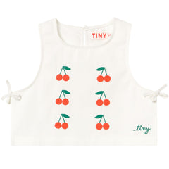 The Mini Cherries Twill Top by Tiny Cottons, off-white sleeveless top with cherry embroidery and side tie details.