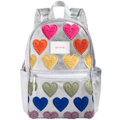 The Kane Backpack from State Bags. Backpack with colorful heart patterns on a white background.