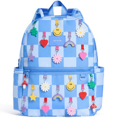 State Bags Kane Backpack with blue checkered print, colorful charm graphics, and front zip pocket
