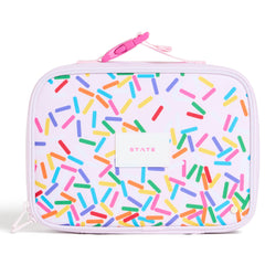 State Bags Rodgers Lunch Box with colorful sprinkle print, zip closure, carry loop, and STATE logo patch