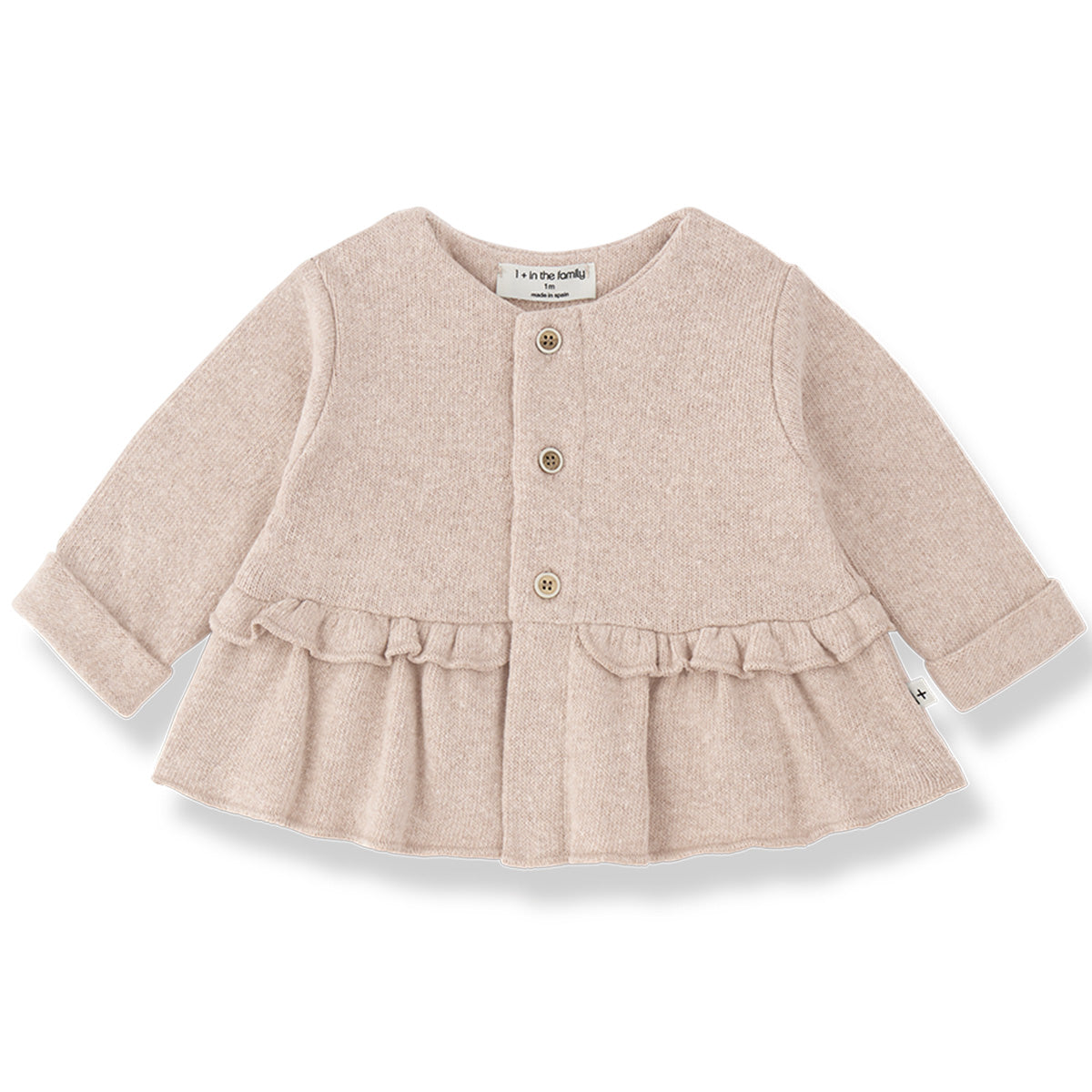 Strasbourg Cardigan by 1+ in the Family in beige with buttons and a ruffled hem.