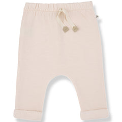 The Telos Pants from 1+ in the Family, soft baby pants with an elastic waistband, drawstring, and rolled cuffs.