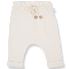 The Telos Pants from 1+ in the Family, soft baby pants with an elastic waistband, drawstring, and rolled cuffs.