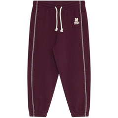 The TNS Logo Jogging Pants from The New Society, joggers with drawstring waist, contrast stitching, cuffs, and logo print.