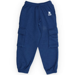 TNS Logo Jogging from The New Society in navy blue cotton fleece with elastic waist, cargo pockets, and logo detail