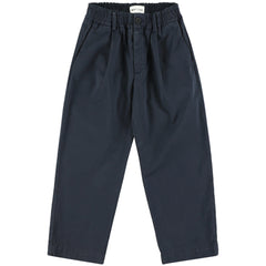 The Vasco Pants from Morley. These navy trousers feature a relaxed fit with a slightly tapered leg, front pleats.