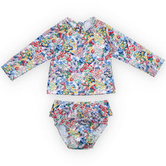 Verbena Baby Swimsuit from The New Society with long-sleeve top and ruffled bottoms in colourful floral print