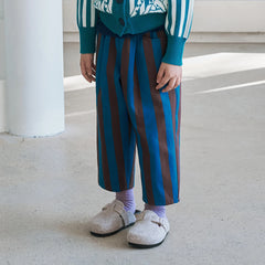Momohanipopo Vintage Stripe Pants featuring bold teal and brown vertical stripes, front pleats, and a relaxed wide leg.