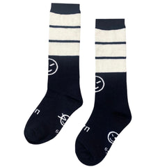The Presto Socks from Wynken. Pair of navy and white striped socks with smiley face design on a white background.