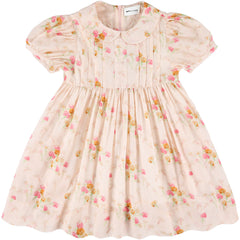 The Xori Dress from Morley, blush floral dress with Peter Pan collar, puff sleeves, pintucks, and gathered skirt.