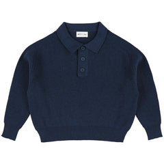 The Zietse Polo from Morley featuring a ribbed knit texture, button placket, collar, and long sleeves.