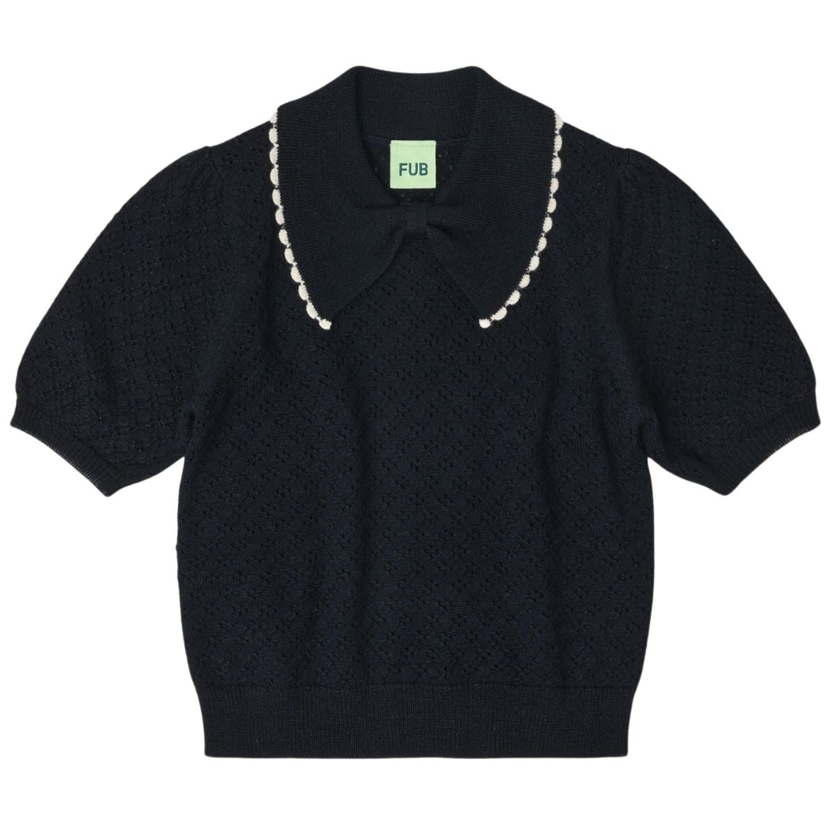 The Pointelle Polo from FUB. It has a regular fit, a bow collar with a contrast color lace edge, and ribbed hems.