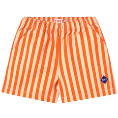 The Stripes Short from Tiny Cottons. Our vanilla and red striped shorts offer the perfect balance of comfort and style.