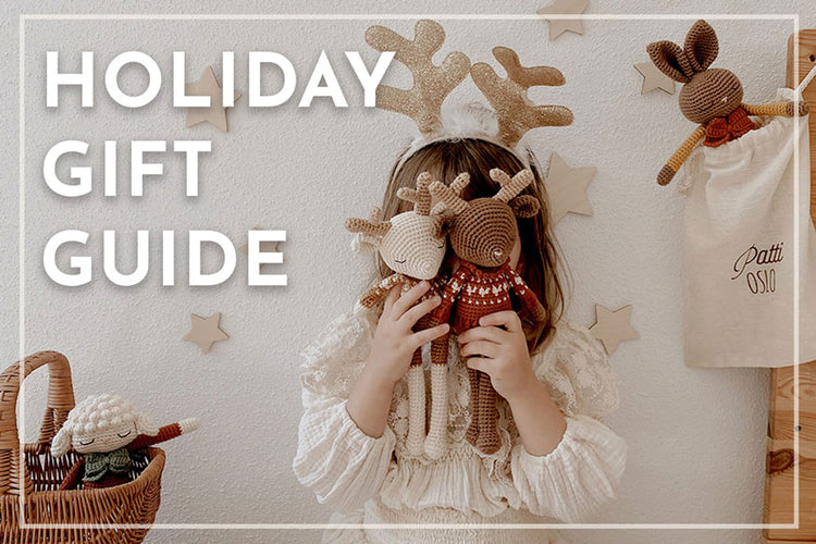 Child holding toy deer with 'Holiday Gift Guide' text overlay